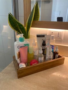 a wooden tray holding various personal care items