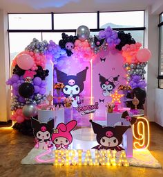 a birthday party with balloons and decorations in the shape of animals, cats and kittens