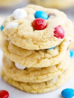 cookies with m & m candies are stacked on top of each other