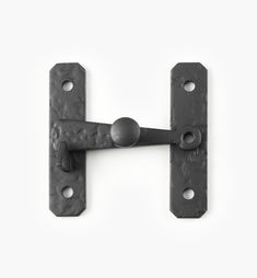 an iron door handle on a white background