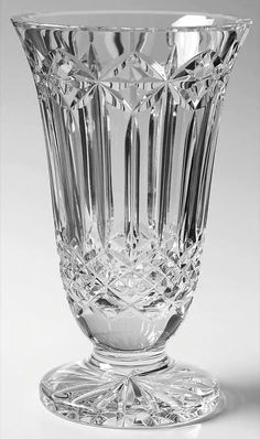 a clear glass vase sitting on top of a table