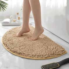 a person standing on top of a bath mat