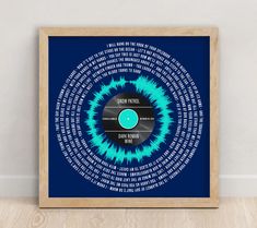 a blue and black poster with words in the shape of a record on it's side