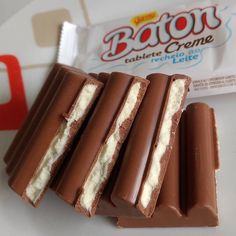 chocolate bars with white cream filling sitting on top of each other