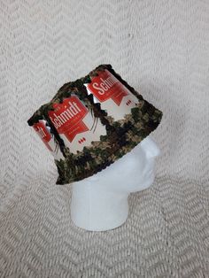 "This a fun and unique item! Be the life of any party with this zany beer can hat. This is made from real Schmidt beer cans with camouflage acrylic yarn. This hat measures 23.5 \" on the inside. This one is larger, designed for a male. This hat will stretch some and is also comfortable if it's a little large. Custom orders are welcome! Send us your idea for can, color and size and we can make it happen! NOTE: these are fragile items. Be gentle with the hat or the cans will bend and crease, resul Crochet Beer Can Hat, Beer Can Hat, Crochet Beer, Beer Cans, Be Gentle, Retro Color, Make It Happen, Beer Can, Schmidt