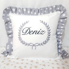 a pillow with the word deniz on it