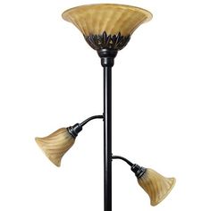 three light floor lamp with glass shades on the top and bottom, black metal base