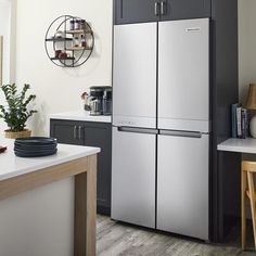 a stainless steel refrigerator in a modern kitchen