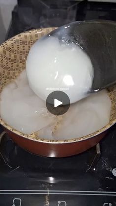 a frying pan filled with eggs on top of a stove