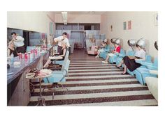 a room filled with lots of blue couches covered in hair dryers and blowdryers