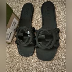 Brand New Only Worn Once! Luxury Black Slides With Buckle Closure, Designer Black Slides With Buckle Closure, Luxury Black Sandals With Rubber Sole, Designer Flat Heel Sandals With Rubber Sole, Designer Sandals With Flat Heel And Rubber Sole, Gucci Slip-on Sandals With Rubber Sole, Gucci Flat Sandals With Removable Insole, Gucci Open Toe Sandals With Rubber Sole, Gucci Cushioned Sandals