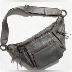 Nwt Free People Austin Leather Sling Bag We The Free In Charcoal. Has A Small Blemish Shown In Pic On Strap Under Side. Gray Leather Bag With Zipper Pocket, Free People Soho Convertible Sling, Free People Wade Leather Sling, Everyday Crossbody Hobo Bag With Silver-tone Hardware, Under Side, Free People Bags, Leather Sling Bag, Charcoal Color, Free Bag