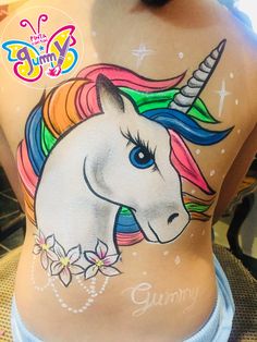 the back of a woman's stomach with an image of a unicorn painted on it