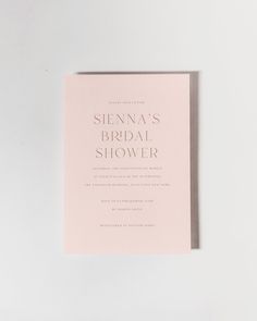 a pink wedding card with the words, sienna's bridal shower on it