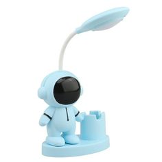 a small blue toy with a light on it's head and an object in the foreground