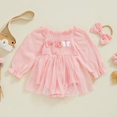 Celebrate her first birthday in style with our ONE Butterfly Tulle Romper Dress. Featuring a delicate butterfly print and embroidered 'one' detail, this lovely tulle dress will make her feel like a princess. Perfect for capturing those precious memories and creating a magical birthday experience. Summer Long Sleeve Tulle Tutu Dress, Spring Long Sleeve Tulle Tutu Dress, Pink Long Sleeve Tutu Dress For Spring, Spring Long Sleeve Pink Tutu Dress, Spring Baptism Long Sleeve Tutu Dress, Long Sleeve Tulle Tutu Dress For Birthday, Summer Outfit Accessories, Long Sleeve Jumpsuits, Her First Birthday