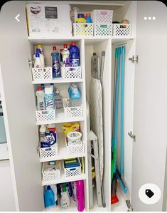 an organized pantry with cleaning supplies and other household care products in white shelving unit