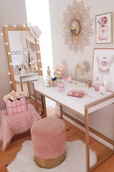 a desk with a mirror, stool and pictures on it