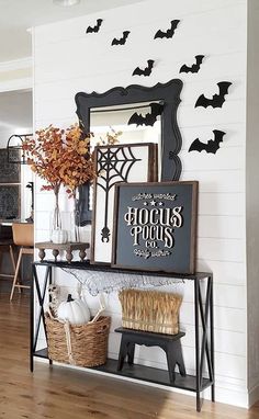 a halloween entryway with bats on the wall