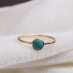 "Materials Gold, Rose gold, White gold Gemstone: turquoise Turquoise Ring / Round Cut Turquoise Ring In 14k Gold / Stackable Turquoise Ring / Natural Turquoise / December Birthstone Ring / Fine Ring Item Features * Made to Order. * Gold KT: 14K * Custom Gold Color: Rose Gold, Yellow Gold, White Gold * Gemstone Cut: Round * Number of Stones: 1 * Stone Size: 4 mm * Setting Type: Bezel * Band Width: 1.25mm * Ring is marked gold Marked * ready to Ship in 7-10 Business Days * Also available in other Gold Turquoise Ring With Gemstone, Gold Turquoise Ring Fine Jewelry, Gold Turquoise Ring Gift, Gold Turquoise Ring For Gift, Dainty Gold Turquoise Gemstone Ring, Dainty Gold Turquoise Ring, Yellow Gold Turquoise Birthstone Ring, Round Turquoise Gemstone Ring In 14k Gold, Gold Turquoise Ring With Bezel Setting As Gift