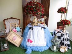 a table topped with lots of different types of decorations and flowers on top of it