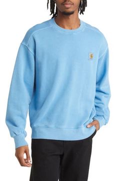 Faded coloring lends well-loved status to a crewneck sweatshirt crafted from soft cotton with a signature logo patch embellished at the chest. 26 1/2" length (size Medium) Crewneck Ribbed cuffs and hem 100% cotton Machine wash, line dry Imported