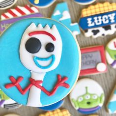 the decorated cookies are all different shapes and sizes, including one with a skeleton on it