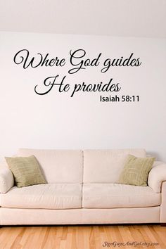 a white couch sitting in front of a wall with the words where god guides he provides