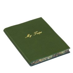 a green book with the words my time written in gold on it's cover