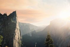 the sun shines brightly over yose peak in yose mountain national park, california