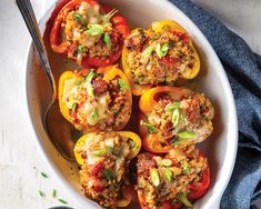 stuffed bell peppers in a white bowl with a spoon