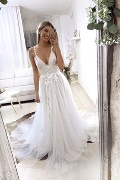 White V-neck Wedding Dress With Sweep Train, White V-neck Wedding Dress With Lace Bodice, V-neck Wedding Evening Dress With Lace Back, White V-neck Gown With Lace Bodice, White V-neck Dress For Debutante Ball, White Prom Gown With Sheer Bodice, V-neck Lace Bodice Prom Gown, White V-neck Evening Dress For Prom Season, Floor-length Dresses For Brides During Prom Season