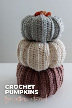 crochet pumpkins are stacked on top of each other