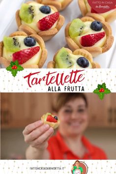 there is a woman holding up some fruit pastries