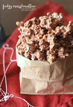 a bag full of chocolate popcorn sitting on top of a table