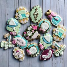 many decorated cookies are arranged on a table