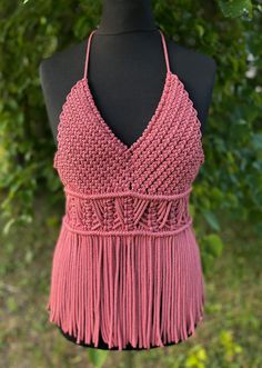 Handmade Macrame Top - a festival essential perfect for Valentine's Day, beach parties, and birthday celebrations. This pink boho-style top adds a touch of charm to your party wear, ensuring you stand out with style at every special occasion. Information: * Material: polyester cord. * Color: pink - ready to ship.  * Size: s-m  * Handmade by myself in Lithuania, Europe. * Size s-m in pink is ready to ship. For other sizes or other colors - please contact me by messages here on Etsy.  Care recommendations: hand-wash only with soup, no tumble dry, lay the garment out to dry on the flat surface, like a sofa, table or countertop. Shipping: ready to ship item will be dispatched in 1-3 business days. Made to order items may take additional 3-7 business depending on cord availability and your requ Summer Fringe Halter Top For Party, Summer Party Fringe Halter Top, Summer Party Halter Top With Fringe, Summer Fringe Halter Top, Bohemian Crochet Halter Neck Top For Festivals, Bohemian Triangle Top For Spring, Summer Beach Halter Top With Fringe, Bohemian Tops For Spring Beach Party, Spring Bohemian Triangle Top