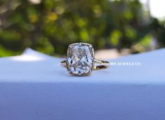 an engagement ring with a cushion cut diamond