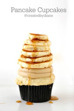 a stack of pancakes sitting on top of a cupcake