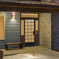 the front door of a house with lights on