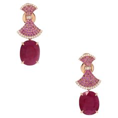 EARRINGS 18K Rose Gold (Matching Ring Available) Weight 6.67 GMS Ruby-2/14.47 CTS Pink Sapphire-118/0.875 CTS Diamond-52/0.305 CTS Introducing our extraordinary Cocktail Earrings, a masterpiece that captures the essence of opulence and sophistication. These stunning earrings showcase a breathtaking combination of a 14.47-carat Ruby, 0.875-carat Pink Sapphire, and 0.305-carat Diamond ensemble, all elegantly set in lustrous 18K Rose Gold. Inspired by oriental motifs, these earrings exude a timeless allure, harmonizing the warm hues of sapphires, rubies, and diamonds. The intricate design reflects a perfect blend of craftsmanship and luxury, making these earrings a statement accessory for those who appreciate the finer things in life. Elevate your style with this exceptional pair, designed to Luxury Gold Ruby Earrings, Luxury Pink Gold Earrings For Formal Occasions, Luxury Pink Gold Earrings For Formal Events, Cocktail Earrings, Matching Ring, Ruby Rose, Matching Rings, Ruby Diamond, Stunning Earrings