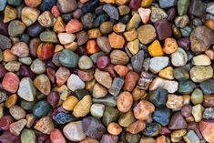 many different colored rocks are arranged together