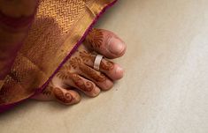 a woman's hand with henna on it