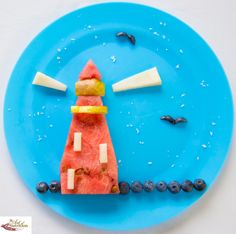 a blue plate topped with watermelon and cheese