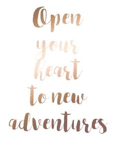 the words open your heart to new adventures written in gold foil on a white background