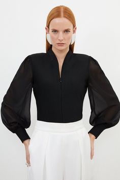 Experience Elevated Basics In A Knit Top, Featuring A Bodice That Hugs The Curves, And Sheer, Chiffon Sleeves With A Balloon Cut For A Playful Edge. The Zip Detail Makes For A Fully Customisable Fit, And Elevates This Piece Into A Day To Night Item, So Pair It With Tailored Trousers Or Jeans And Boots Or Strappy Heels For All Eventualities. Bandage Figure Form Zip Detail Chiffon Sleeve Knit Top High Quality, Soft Knit Fabric Statement, Floating Chiffon Sleeves Deep V Neckline Zip Front Accent Fi Sleeve Types And Styles, Hen Do Outfits, Workwear Capsule Wardrobe, Workwear Capsule, Black Experience, Uniform Ideas, Plus Size Workwear, Ibiza Outfits, Chiffon Sleeves