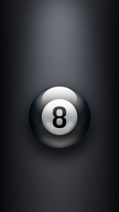 an eight ball is in the middle of a dark room