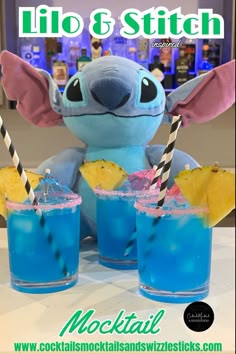 this image shows three blue drinks with pink rim, black and white striped straws, pineapple wedges and cocktail umbrellas in front of a lilo and Stitch Stitch stuffed animal in a home bar Birthday Stitch, Lilo And Stitch Cake, Lila Party, Hawaiian Themed Party