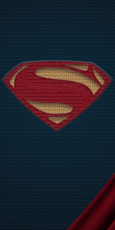 the superman symbol is shown in red and gold