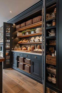 an open kitchen with lots of food on the shelves